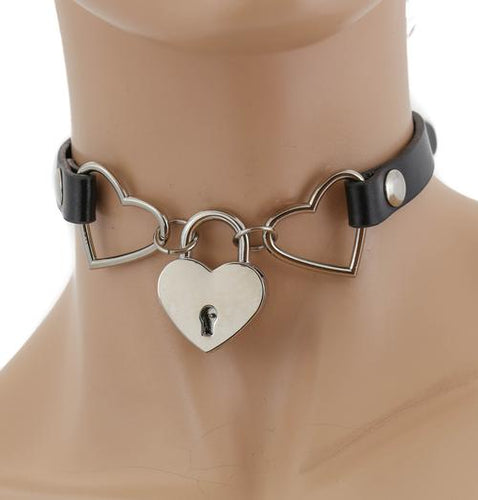 Black leather collar attached to two silver heart charms, with silver locket at front center.