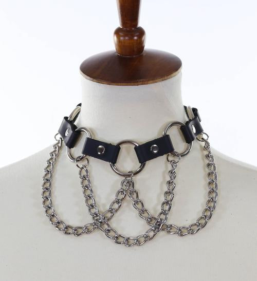 Black leather collar with multiple silver O rings with silver hanging chains.