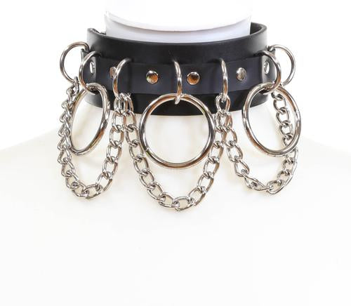 Black leather collar with multi silver D rings, silver hanging chains, and three large silver O rings.