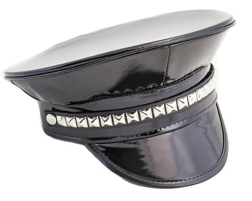 Black vegan shiny patent leather captain hat with row of silver studs on front center.