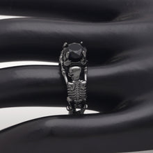 Load image into Gallery viewer, Black skeleton band and large black cubic zirconia on top center.
