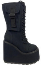 Load image into Gallery viewer, outer view of Women&#39;s black canvas mid-calf platform boot. Full lace up front, with full back zipper. Outside of boot has small pocket with strap.
