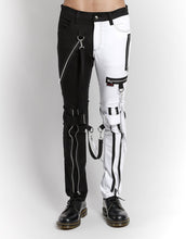 Load image into Gallery viewer, front of Classic slim White/Black split leg pants with removable bondage straps and zipper details. Pant legs can be zipped for a change in fit, topped off with a zip fly and button closure.
