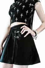 Load image into Gallery viewer, front of Black pleated skirt with front silver safety pin details.
