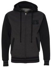Load image into Gallery viewer, front of Lucky 13 charcoal gray heather black zip-up hooded sweatshirt has jacquard ribbing at cuffs and waistband and gunmetal eyelets. Hoodie has classic &quot;Skull Stars&quot; logo in grey (tonal) on the back with the skull stars embroidered patch (also tonal in dark charcoal) on the front left chest.
