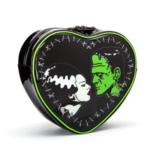 Load image into Gallery viewer, front of Black heart-shaped mini backpack with Bride and Frankenstein&#39;s monster graphic on front. Cobweb lining with one inside Velcro pouch.
