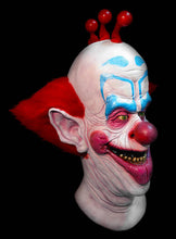Load image into Gallery viewer, latex mask of slim the clown from killer klowns from outer space. mask has red hair on top and sides
