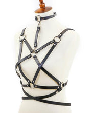 Load image into Gallery viewer, mannequin displaying black leather inverted pentagram shaped eight strap body harness with attached choker and multiple silver o rings
