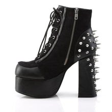 Load image into Gallery viewer, left side view of black vegan leather with suede panels 4.5 inch heel ankle boot with three O ring designs with spike in middle on each side of boot, tree spikes and s tuds on the back and 7 eyelet lace-up front with full left side zipper
