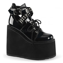 Load image into Gallery viewer, outer side view of black vinyl 5.5&quot; wedge platform Mary Jane style Lace-up front Wrap around style studded adjustable strap around ankle

