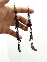 Load image into Gallery viewer, Three silver zinc alloy chains hanging from hook stud. Chains hang at different lengths with an acrylic black see-through bat hanging from each chain.
