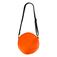 Load image into Gallery viewer, woman wearing bag on shoulder. bag is orange with yellow eyes and yellow teeth, with a black adjustable strap. based on sam&#39;s jack o lantern in the movie trick r&#39; treat
