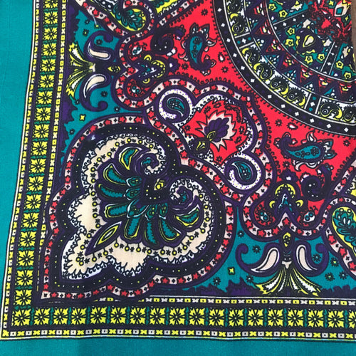 Blue/Green bandana with multi-colored green, red, yellow and blue paisley print.