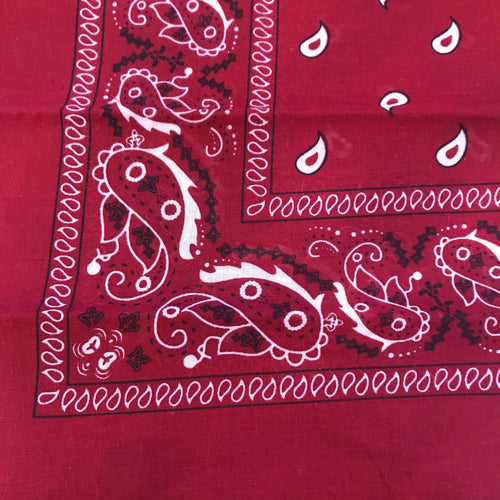 Burgundy red bandana with black and white paisley print.