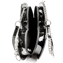 Load image into Gallery viewer, inside view of heart shaped glossy black bag with a stitched spiderweb design at the bottom, chain link hardware and faux leather straps.
