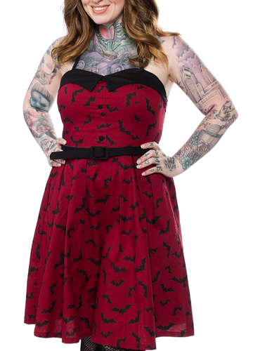 front view of Red spaghetti straps above the knee dress with black bat sihouette repeat pattern all over with attached adjustable black belt.
